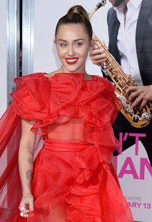Miley Cyrus in red see through dress at Isn't It Romantic premiere - February 11, 2019 Miley Cyrus in red see through dress at Isn't It Romantic premiere - February 11, 2019