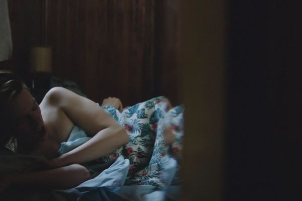 Andrea Carballo nude boobs on a bed scenes from Finding Sofia (2016). 