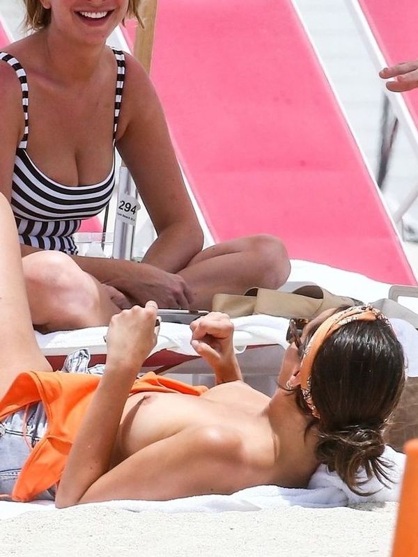 Kristen Doute topless on a beach as she relaxes with Scheana Shay, Stassi S...