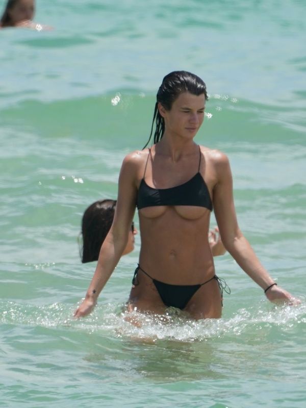 Destiny Sierra bottom of boobs in a tiny black bikini at the beach in Miami...