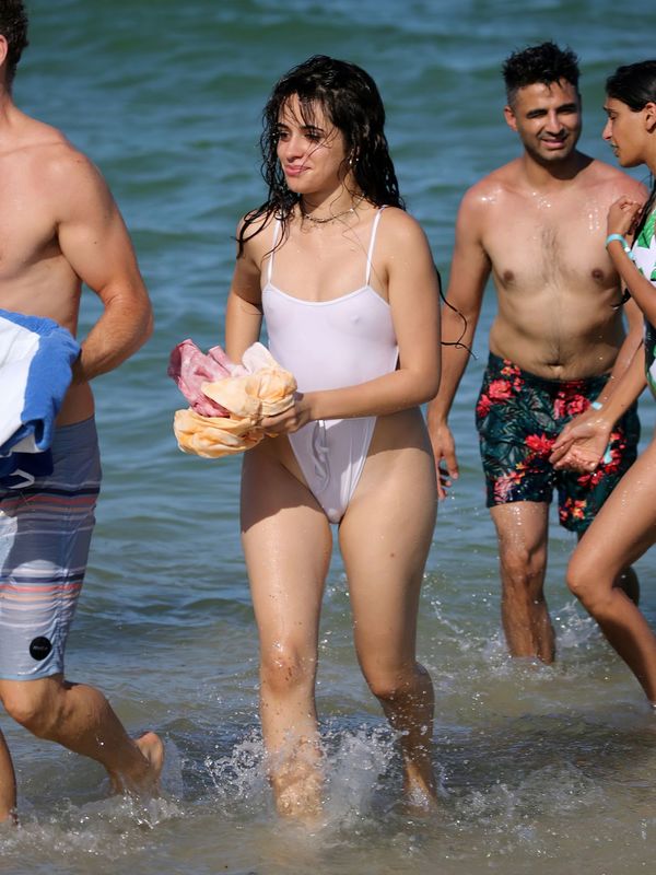 Camila Cabello in wet see through swimsuit at the beach in Miami - July 29,...