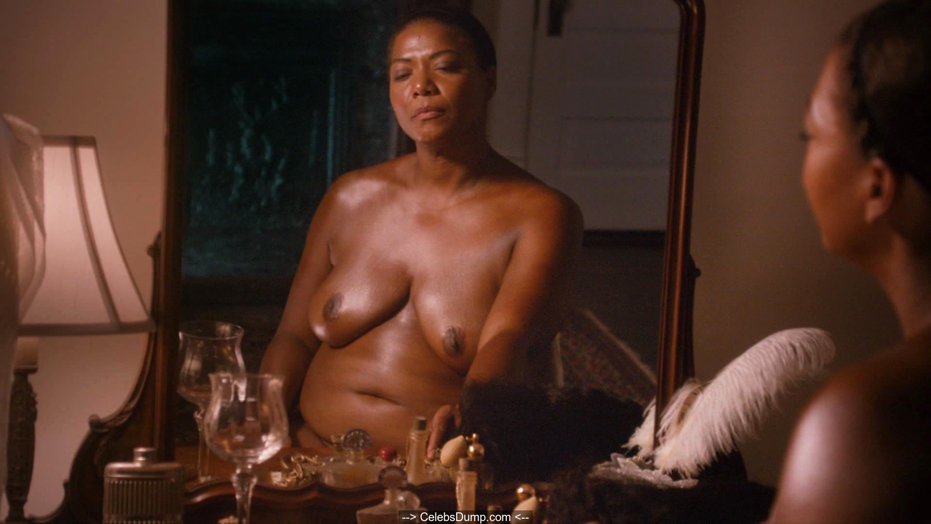 Queen Latifah topless in a mirror at Bessie (2015) .