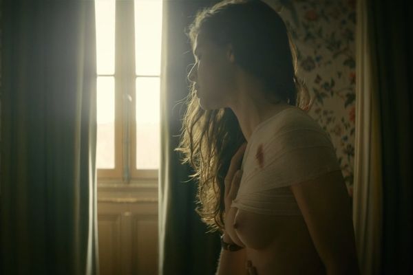 French actress Esther Comar shows her nude tits vidcaps. 