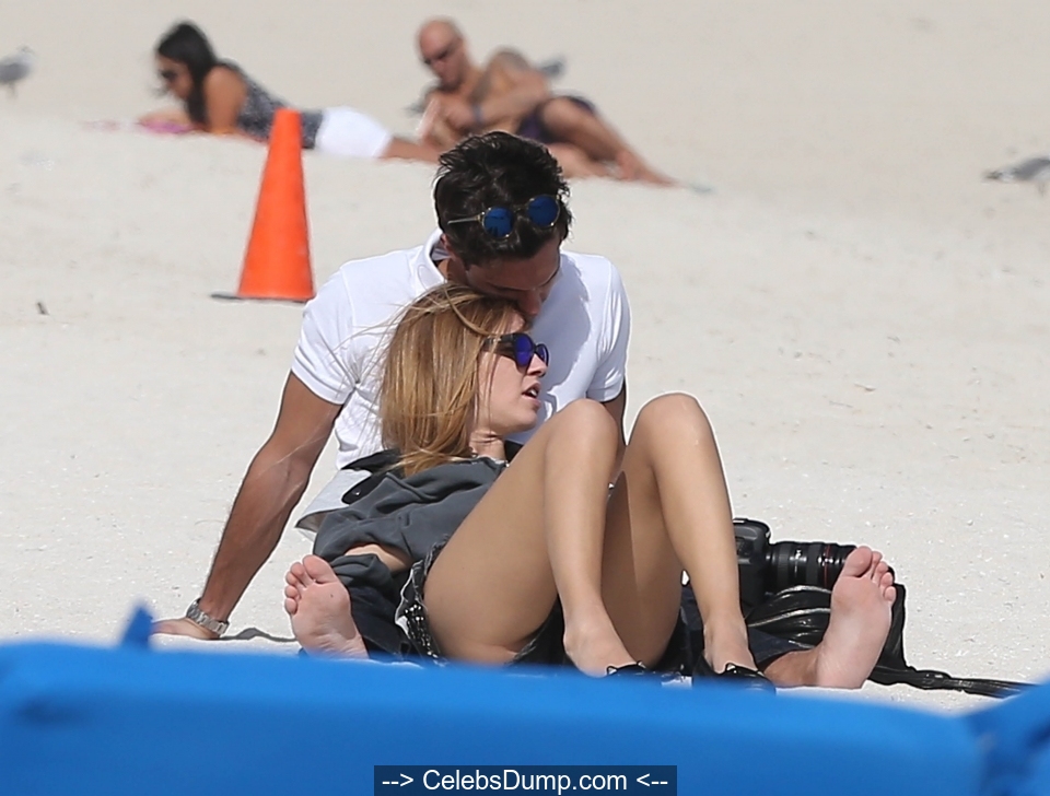 Chiara Ferragni topless in denim shorts on a beach paparazzi photos - 2012.