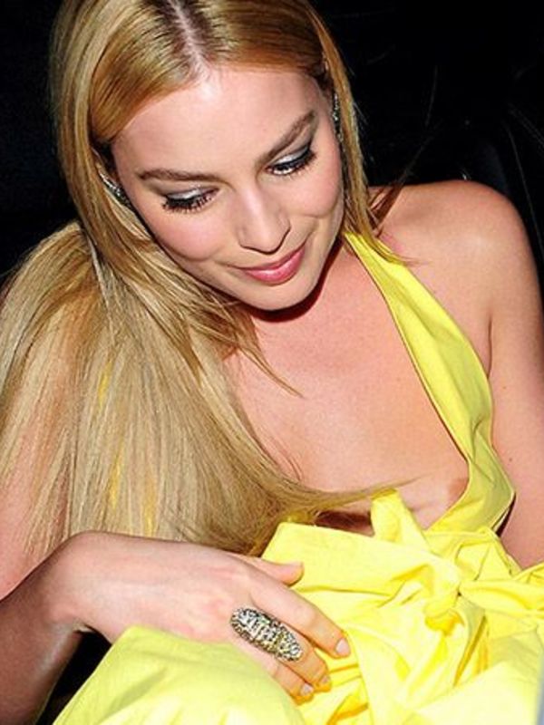 Margot Robbie nipple slip in yellow dress paparazzi photos.