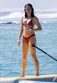 Margaret Qualley in red bikini on the beach in Hawaii - November 03, 2025