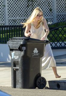 Dakota Fanning braless gets her trash can in Los Angeles - October 31, 2025
