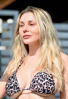 Courtney Stodden was seen taking out the trash and her Calabasas home wearing a bikini top and floaty pants today - October 21, 2025