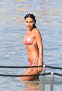 Chantel Jeffries rocking a tiny pink two-piece as she hits the beach in Mykonos with male model Manos Vrontzakis - August 14, 2026